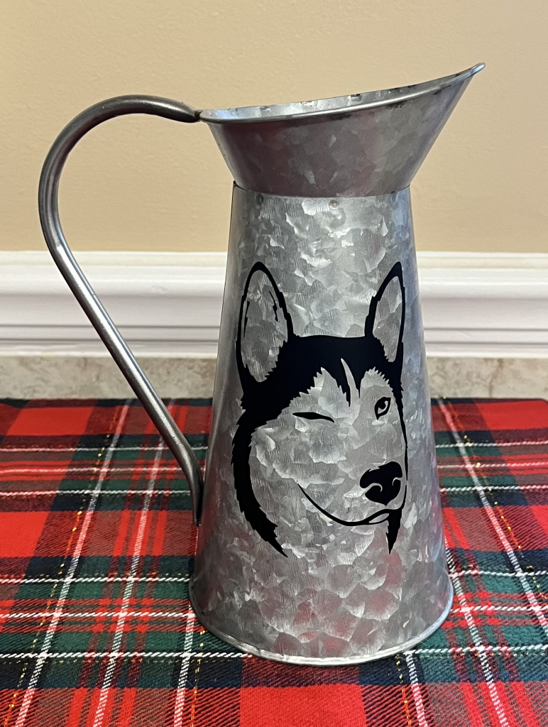 Image of Metal Pitcher with Husky winking